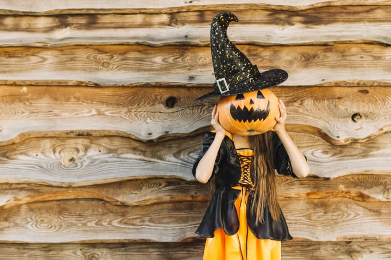 Kid Witch Clothes Closing Face By Pumpkin With Hat