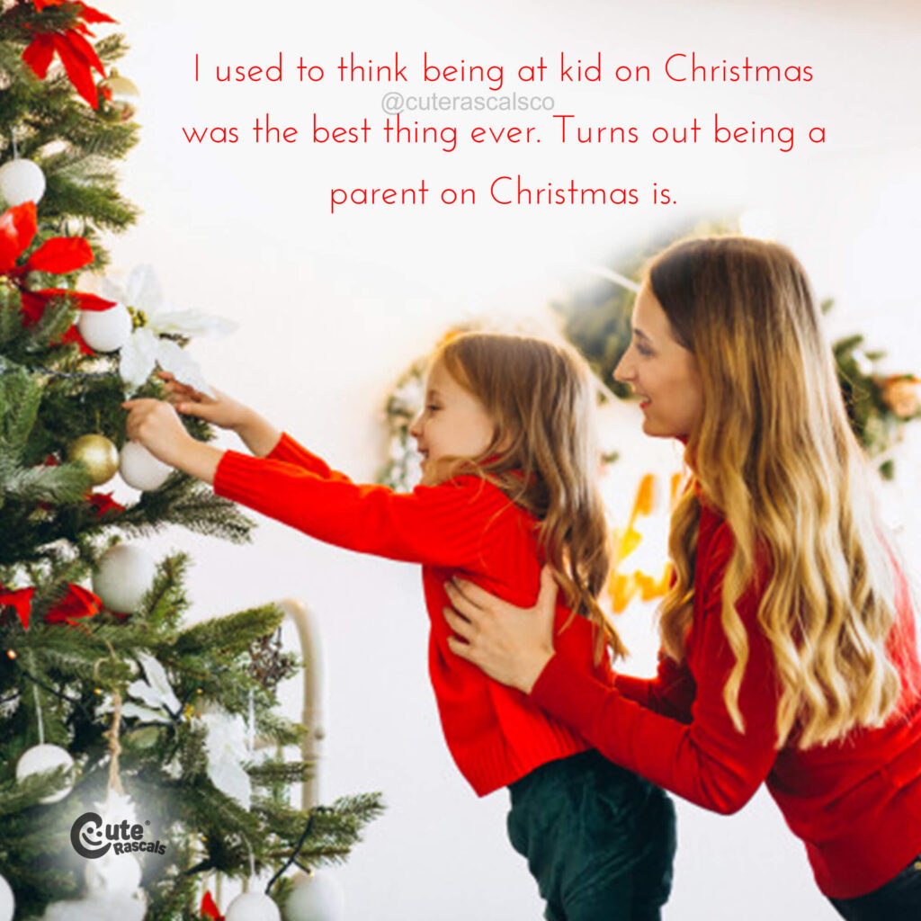 Mom and daughter decorating the Christmas tree with a loving Christmas quote
