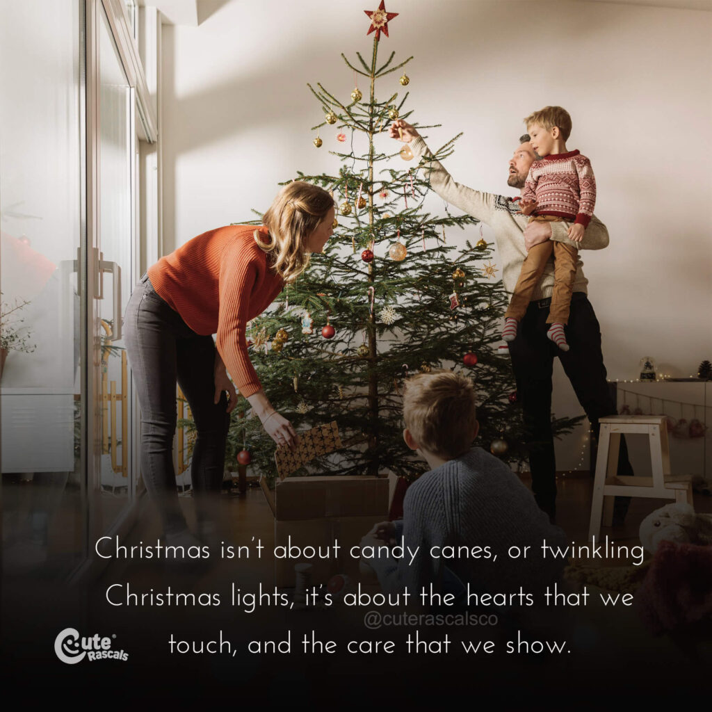 Happy family decorating the Christmas tree with a good Christmas quote