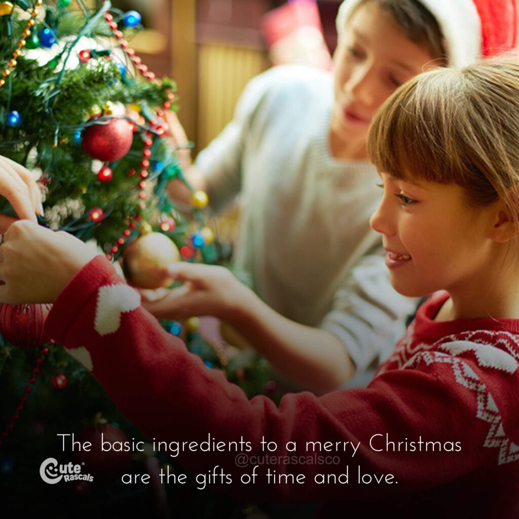 Kids hanging Christmas ornaments with a Christmas quote
