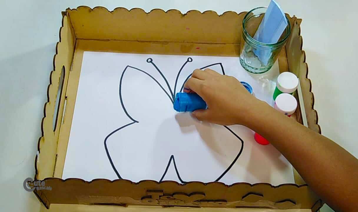 Pour the different colored paints all over the drawing