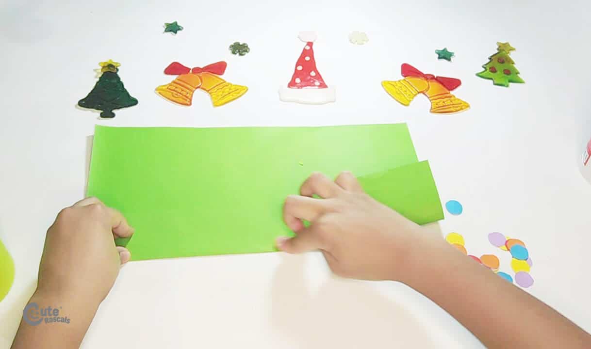 Fold a section of the other green sheet. Fun paper Christmas tree craft