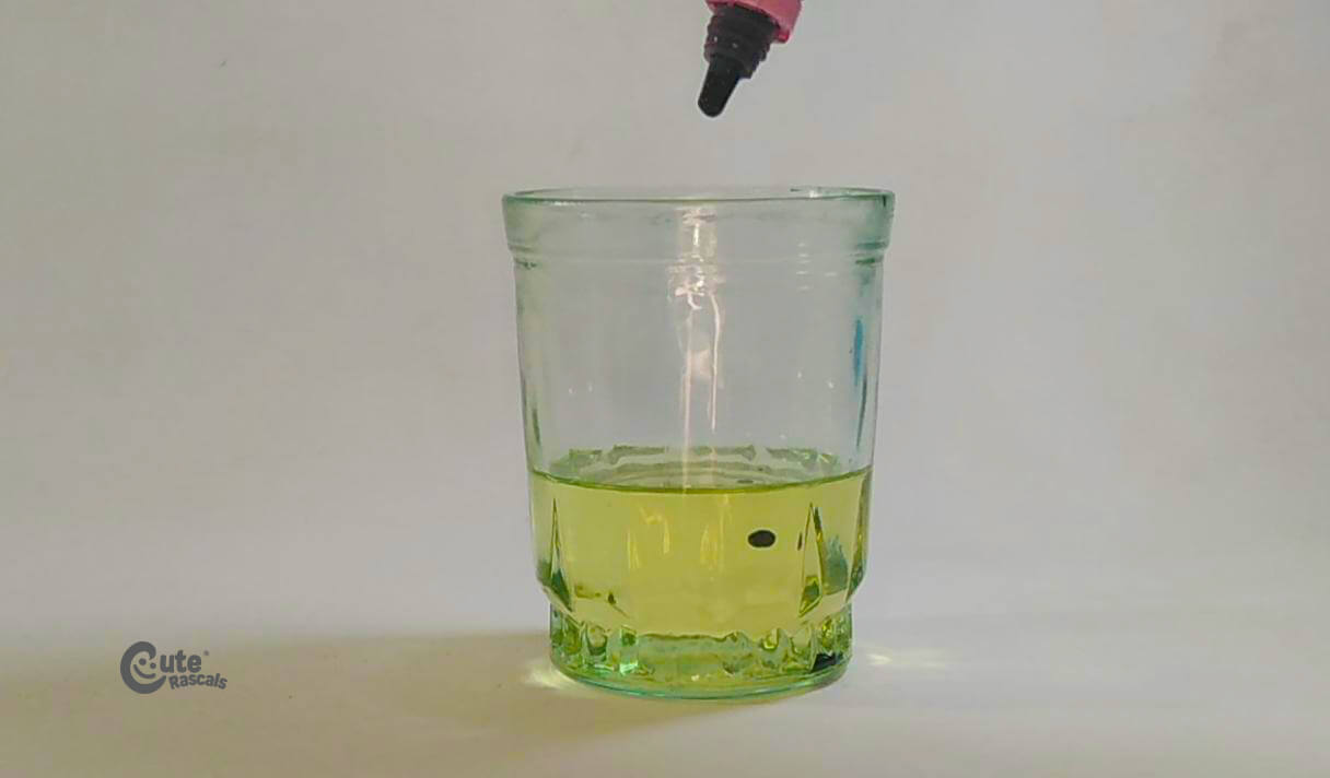 Put some drops of food coloring in the oil