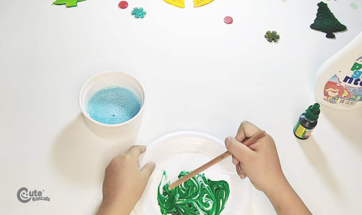 Put some green food coloring drops. Christmas science experiments