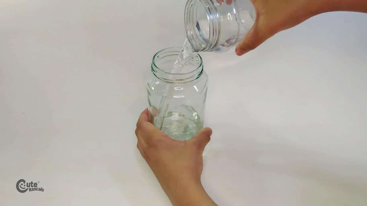 Pour the water into the glass bottle
