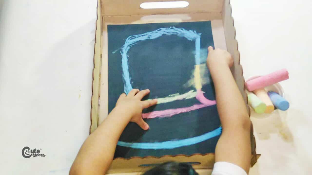 blend each color with the index finger for this chalk art for kids activity