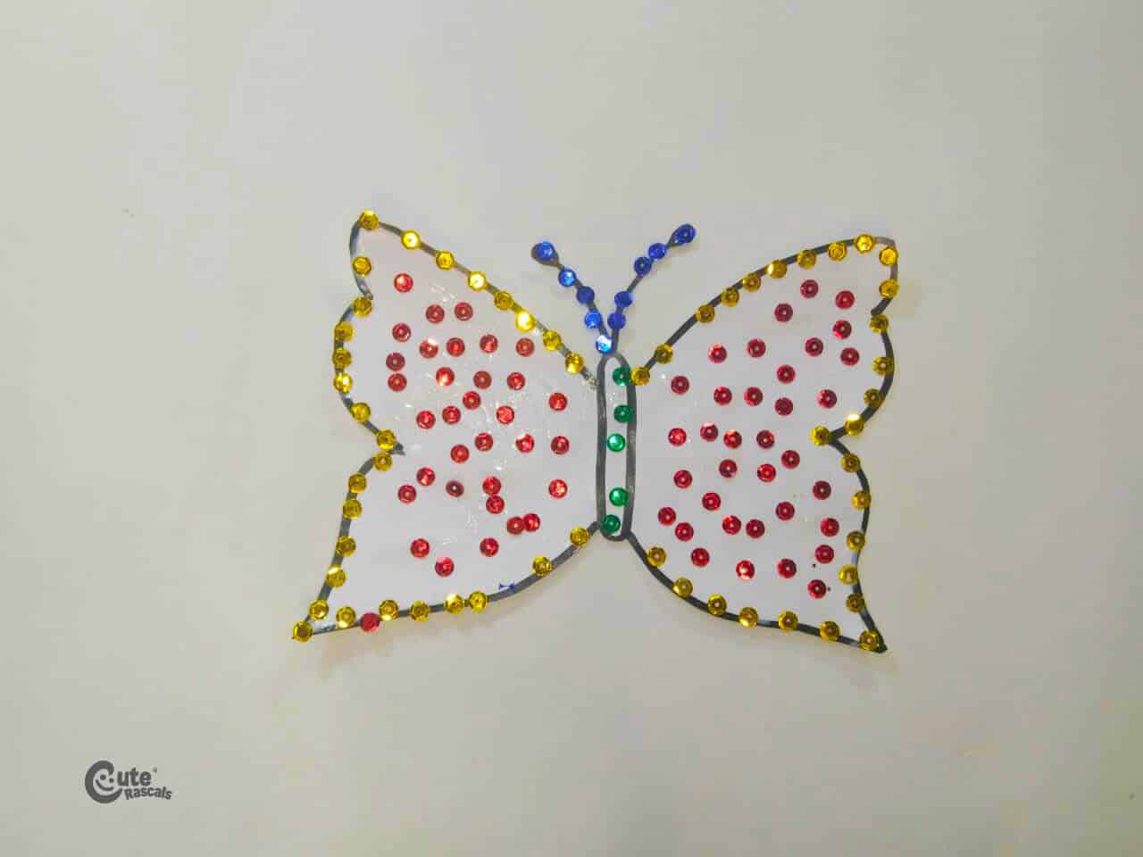 Butterfly with colorful sequins. A butterfly crafts for kids.
