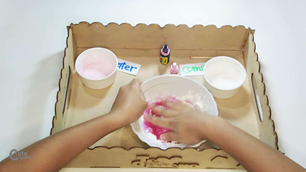 Pour the water with the food coloring over the cornstarch