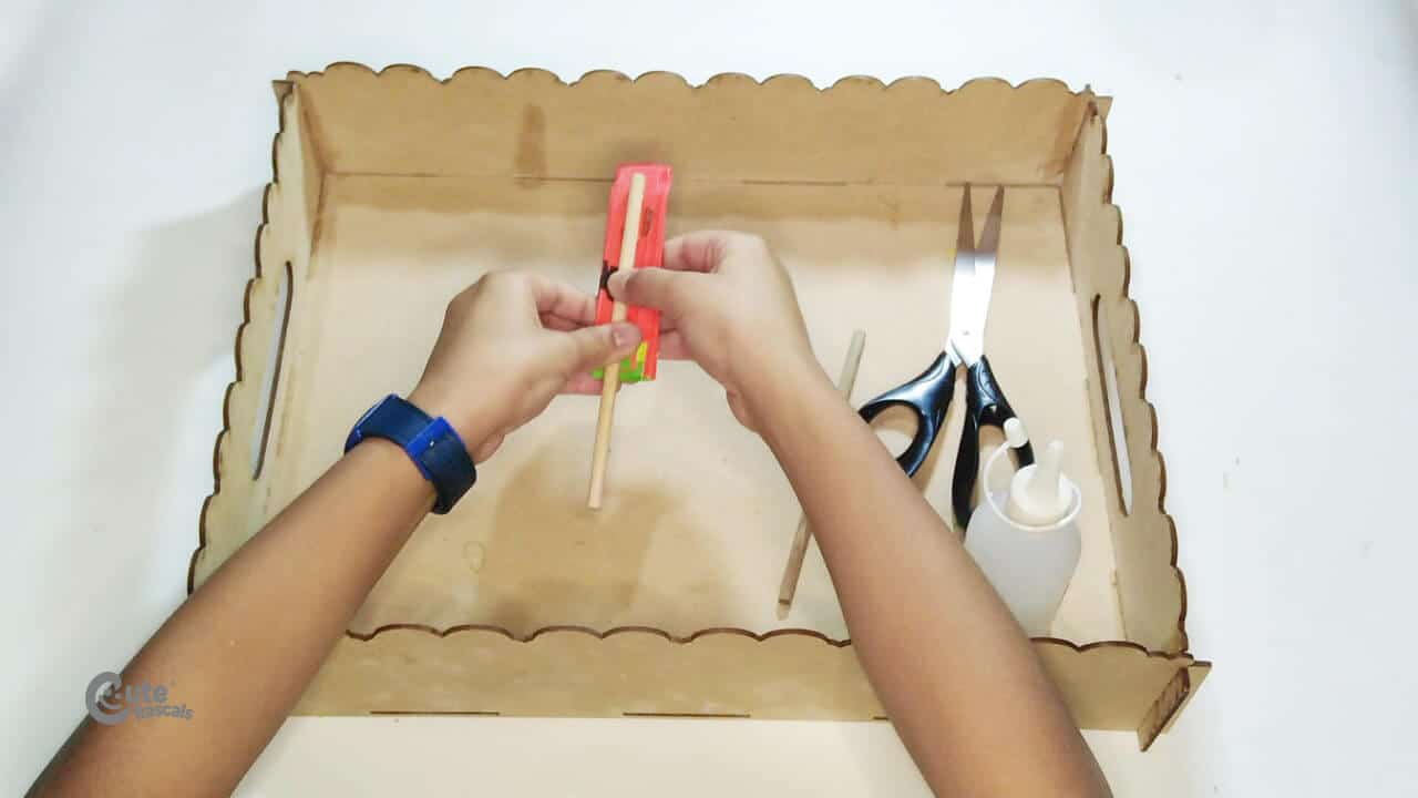 glue two wooden sticks on the bottom. Easy cool crafts with paper