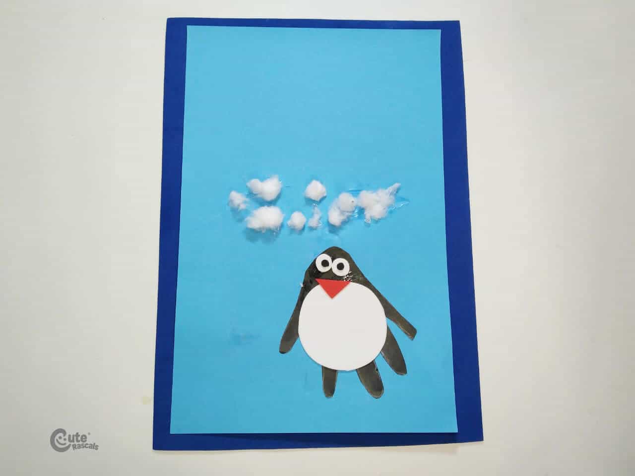 glue some cotton balls above the penguin image