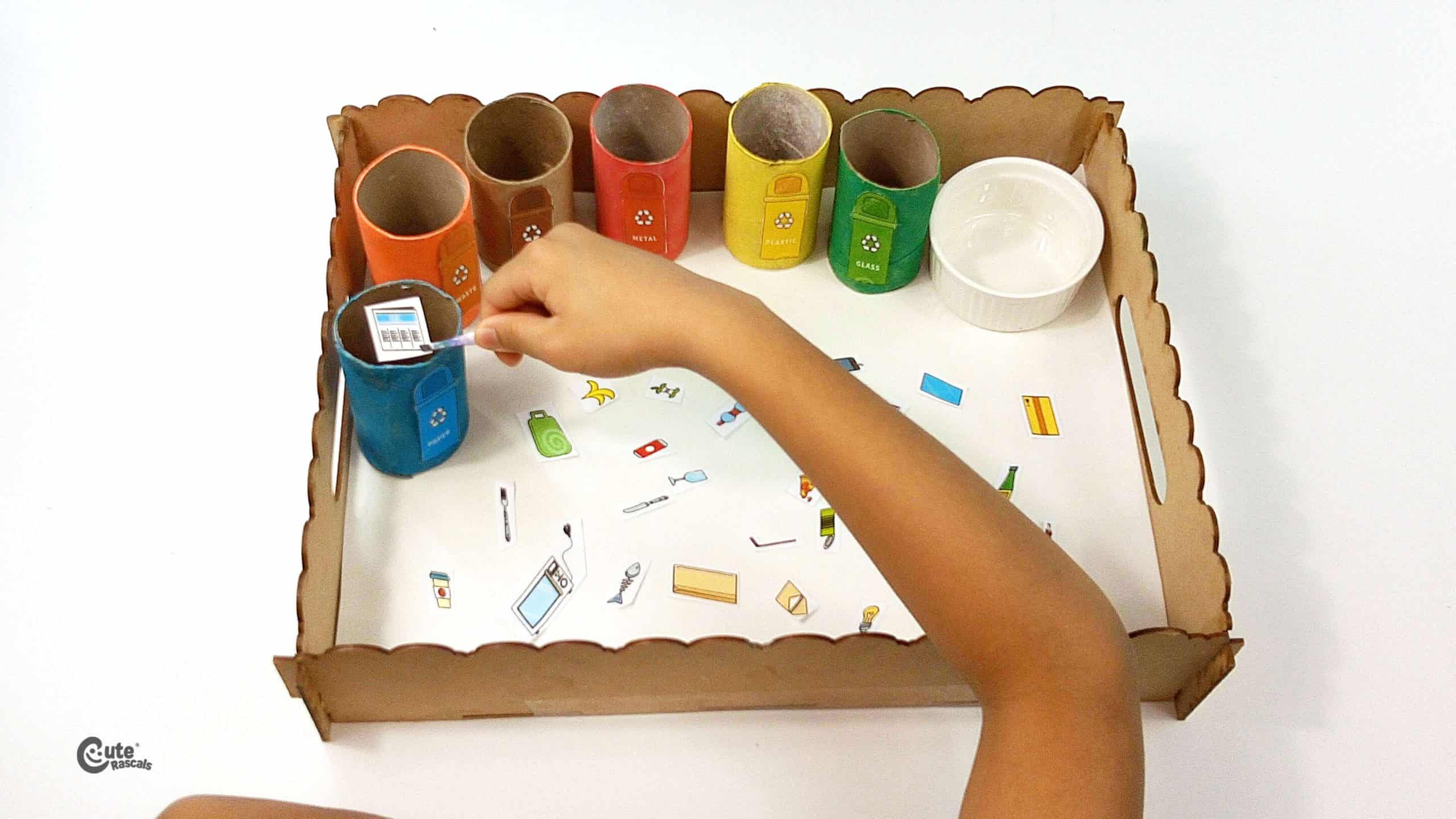 Place the waste images within the cardboard tubes
