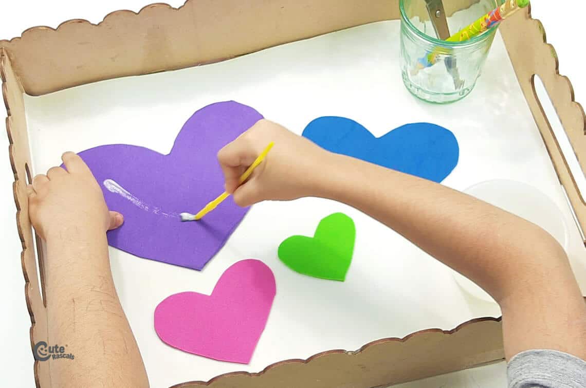 spread the glue all over the hearts. easy Mother's Day crafts for preschoolers