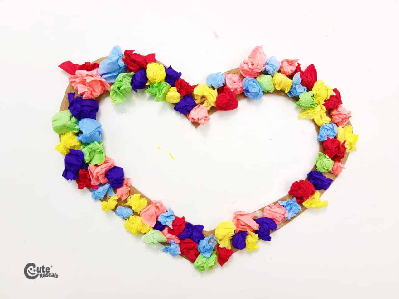handcraft of a heart decorated with tissue paper balls