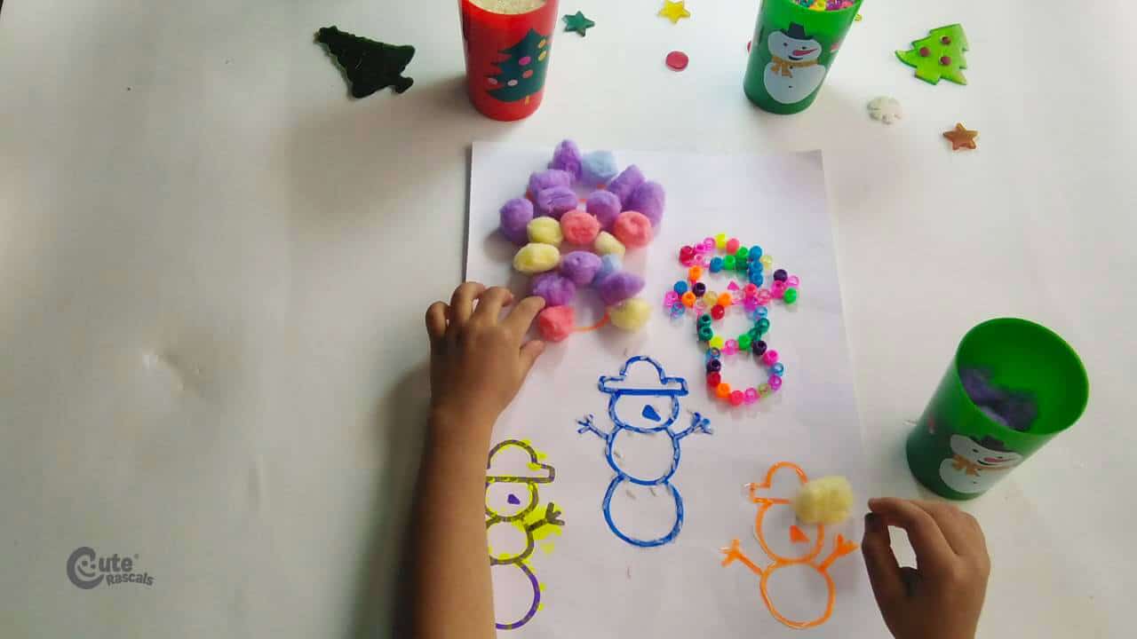 Spread glue all over the second snowman